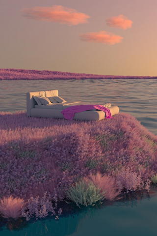 A couch sitting on top of a lush green field next to a body of water photo mobile wallpaper